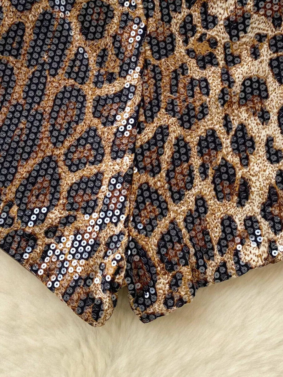 Leopard print fabric with sequins on a beige background