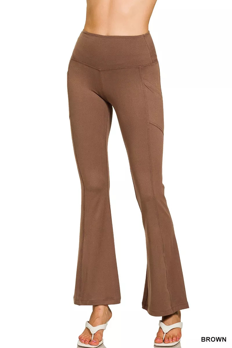 Brown flared pants on a white background
