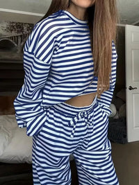 Person wearing a blue and white striped outfit in a room.