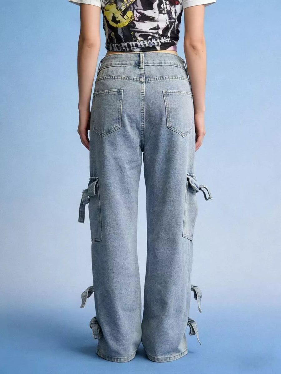 Person wearing light blue cargo pants on a blue background