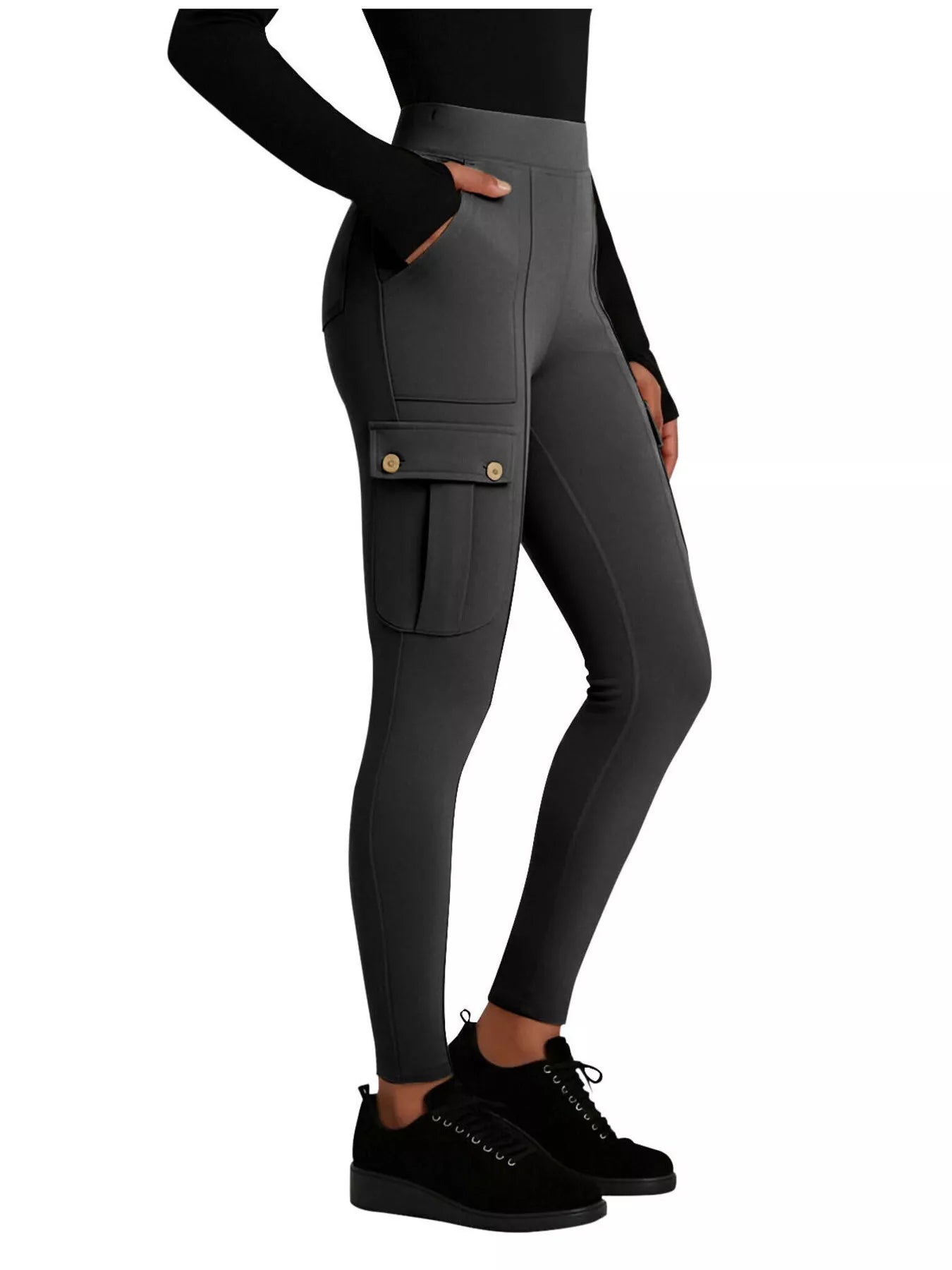 Dark gray leggings with pockets worn by a person on a white background