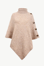 Beige poncho with button details on a white background