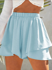 Light blue skirt worn by a person with a blurred background