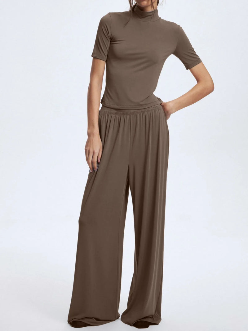 Brown outfit with a top and wide-leg pants on a white background