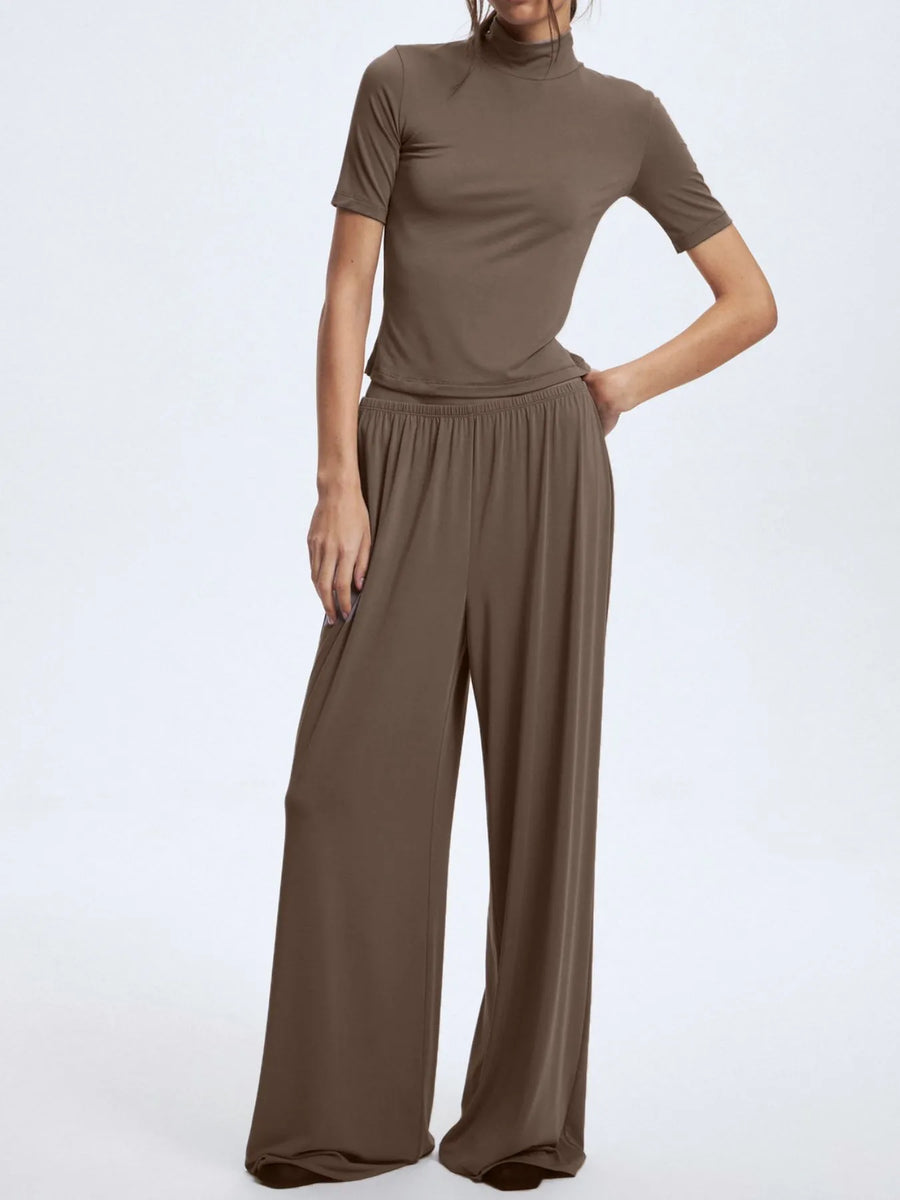 Brown outfit with a top and wide-leg pants on a white background