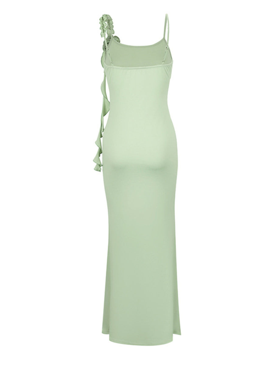 Light green dress with floral straps on a white background