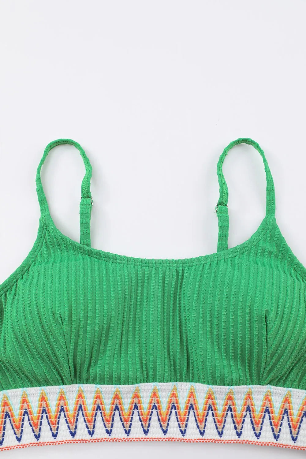 Green ribbed crop top with zigzag pattern on a white background