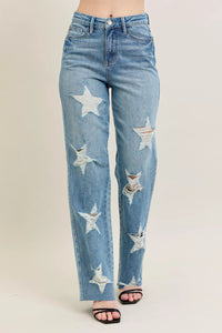Blue jeans with star patterns on a beige background