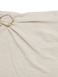 Beige fabric with a gold ring detail on a white background