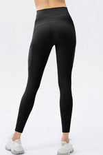 Black leggings worn by a person on a white background