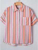 Striped shirt with short sleeves on a hanger against a light gray background