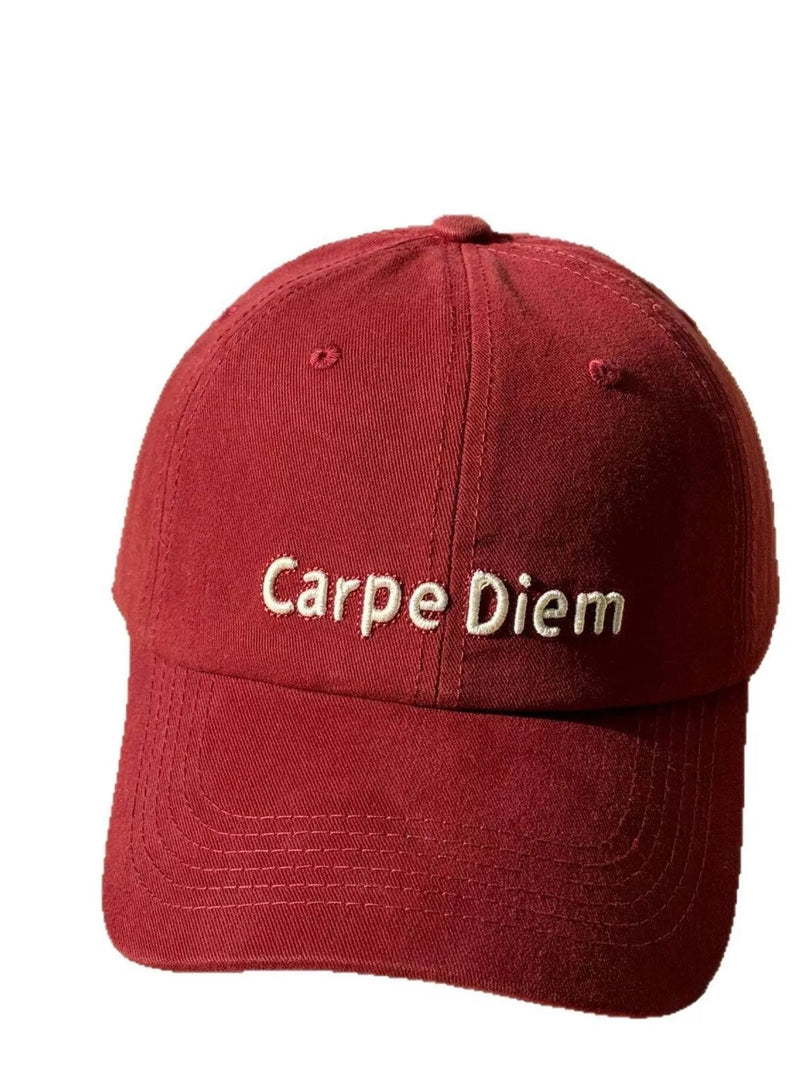 Red cap with 'Carpe Diem' text on a white background