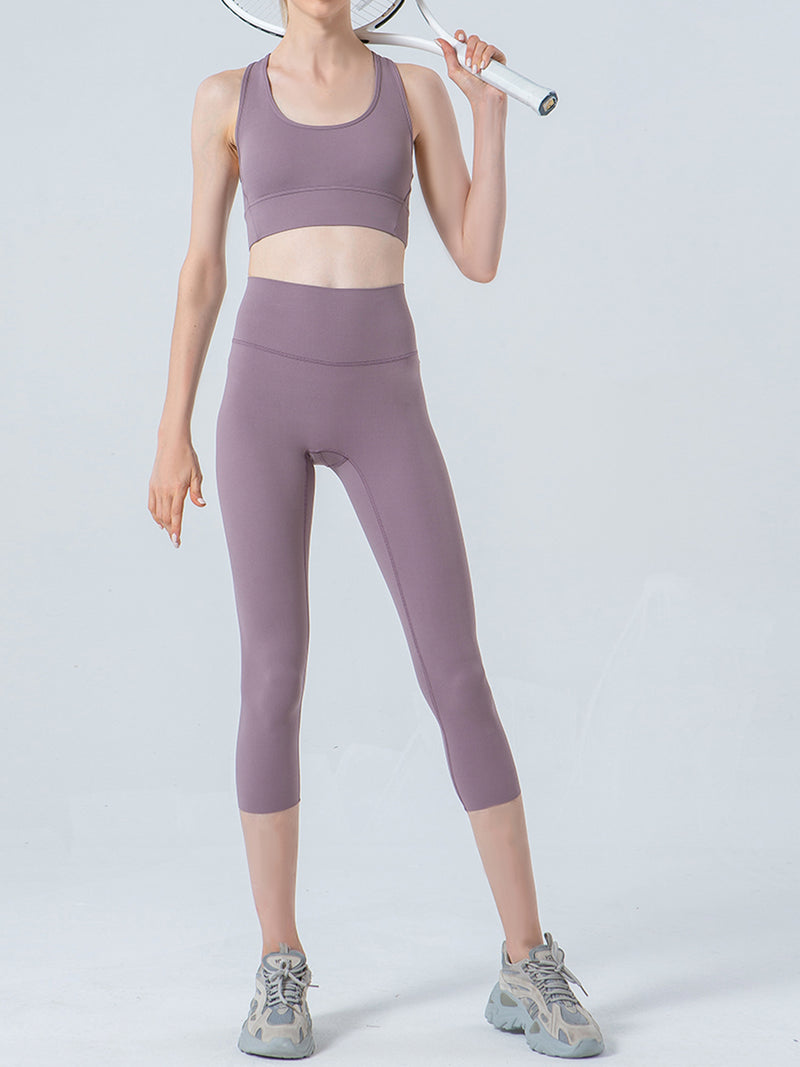 Person wearing a purple athletic outfit on a light gray background