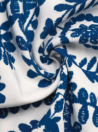 Close-up of blue floral pattern on white fabric