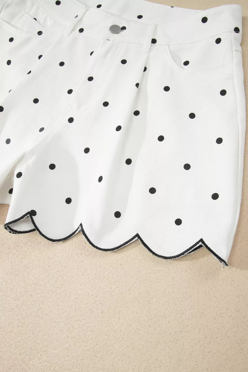 White skirt with black polka dots on a beige background