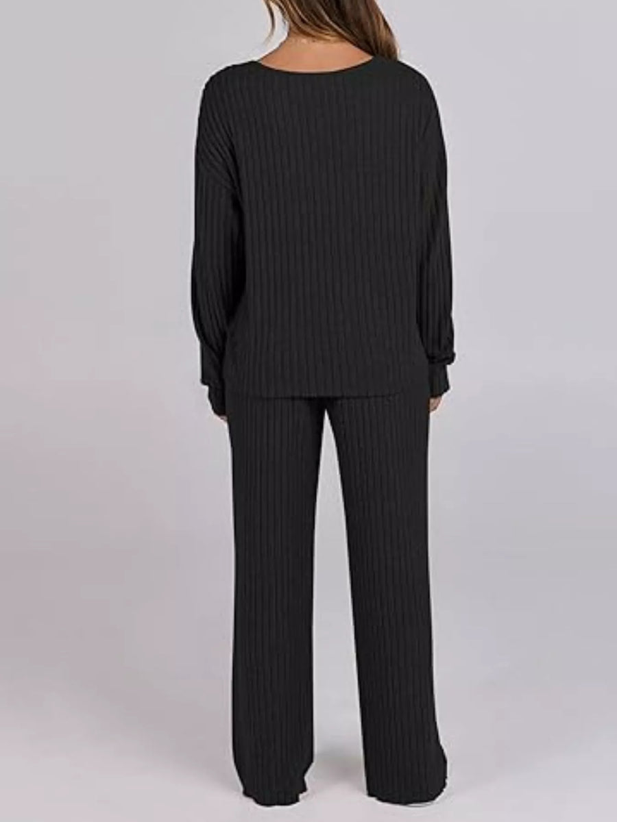 Black ribbed lounge set on a plain background