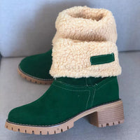 Green ankle boots with beige sherpa lining on a light gray background