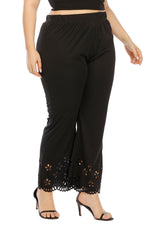 Black pants with lace detailing on a white background