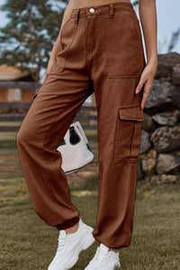 Brown cargo pants worn by a person with a blurred background