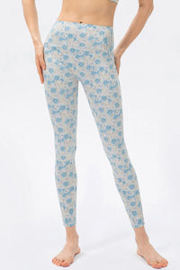 Floral patterned leggings worn by a person on a white background