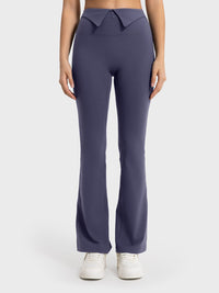 Navy blue pants worn by a person on a white background