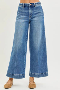 Blue wide-leg jeans on a white background