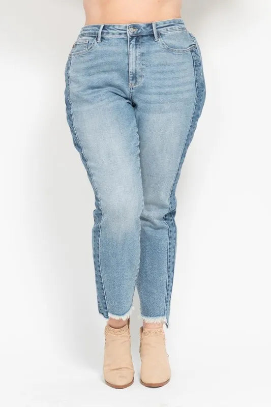 Light blue jeans worn by a person on a white background