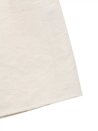 Close-up of a beige fabric texture on a white background