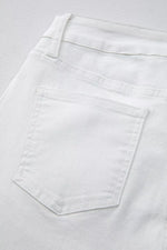 Close-up of a white pocket on light gray fabric