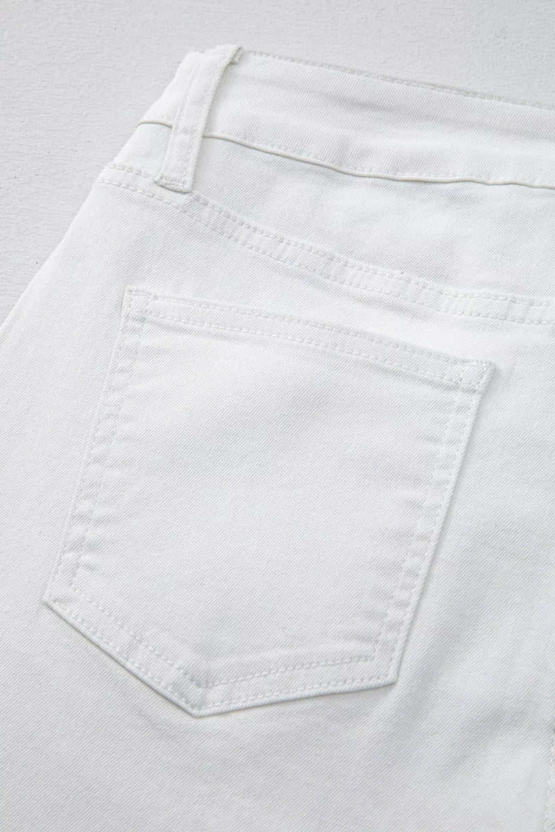 Close-up of a white pocket on light gray fabric