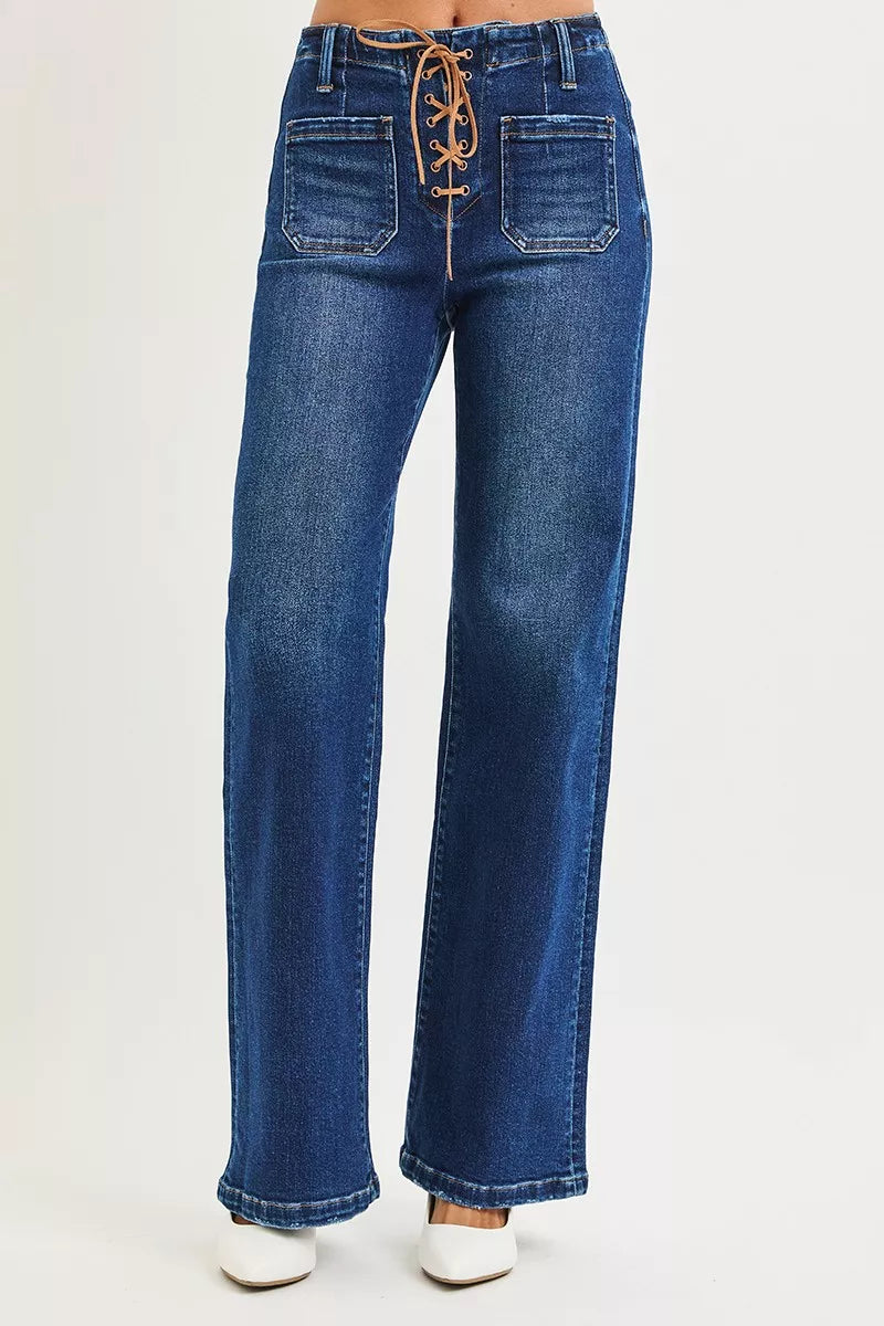 Blue jeans with lace-up front on a white background