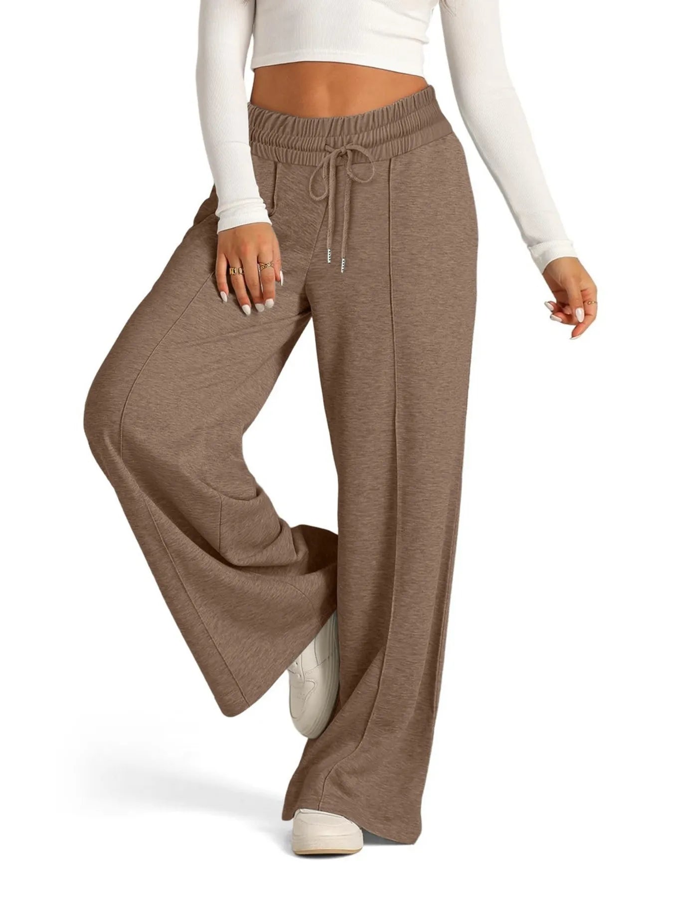 Brown wide-leg pants worn by a person on a white background