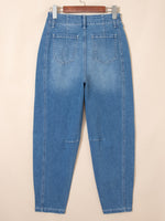Blue jeans on a beige background