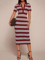 Woman wearing a maroon and white striped dress against a beige background