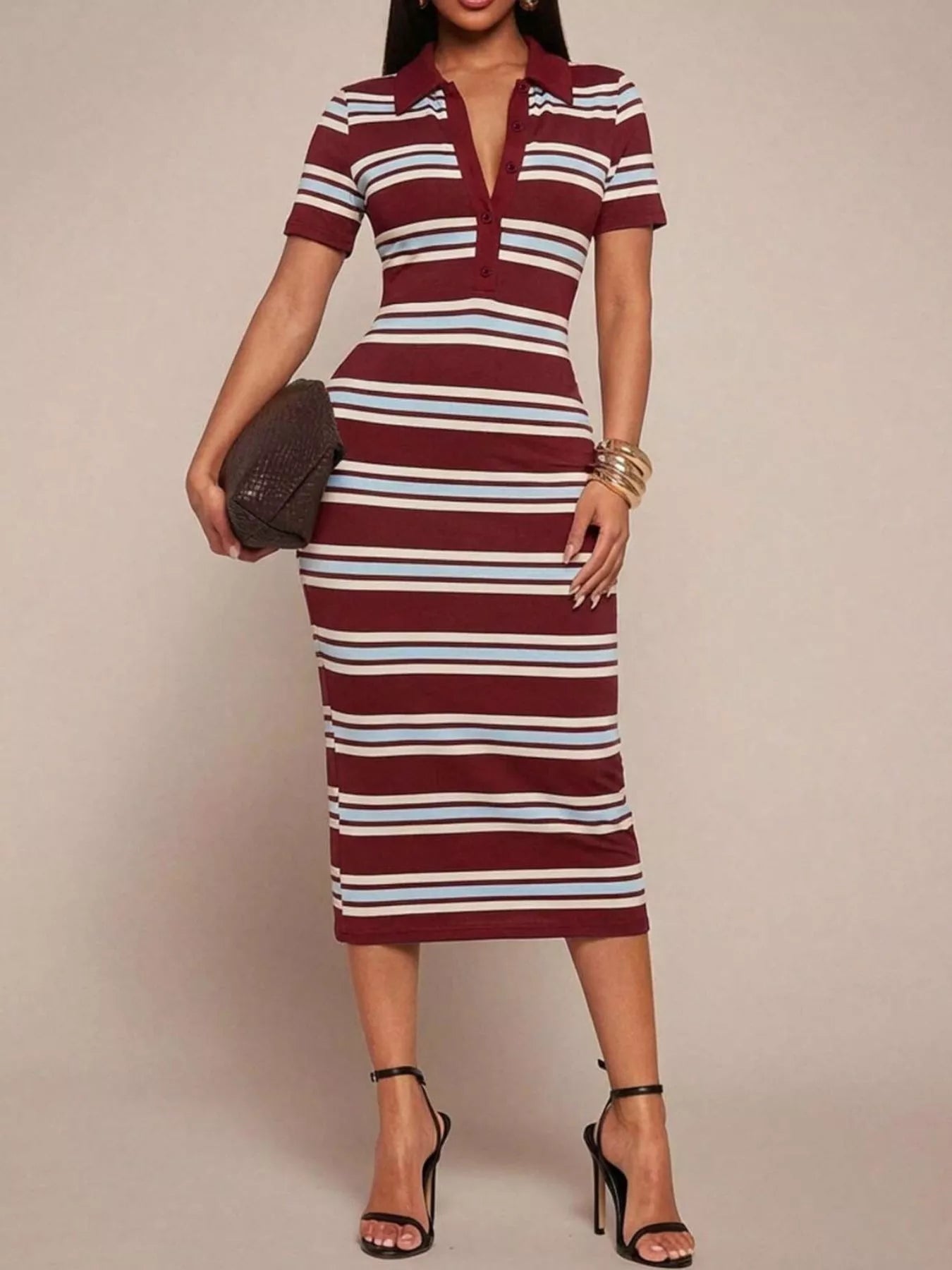 Woman wearing a maroon and white striped dress against a beige background