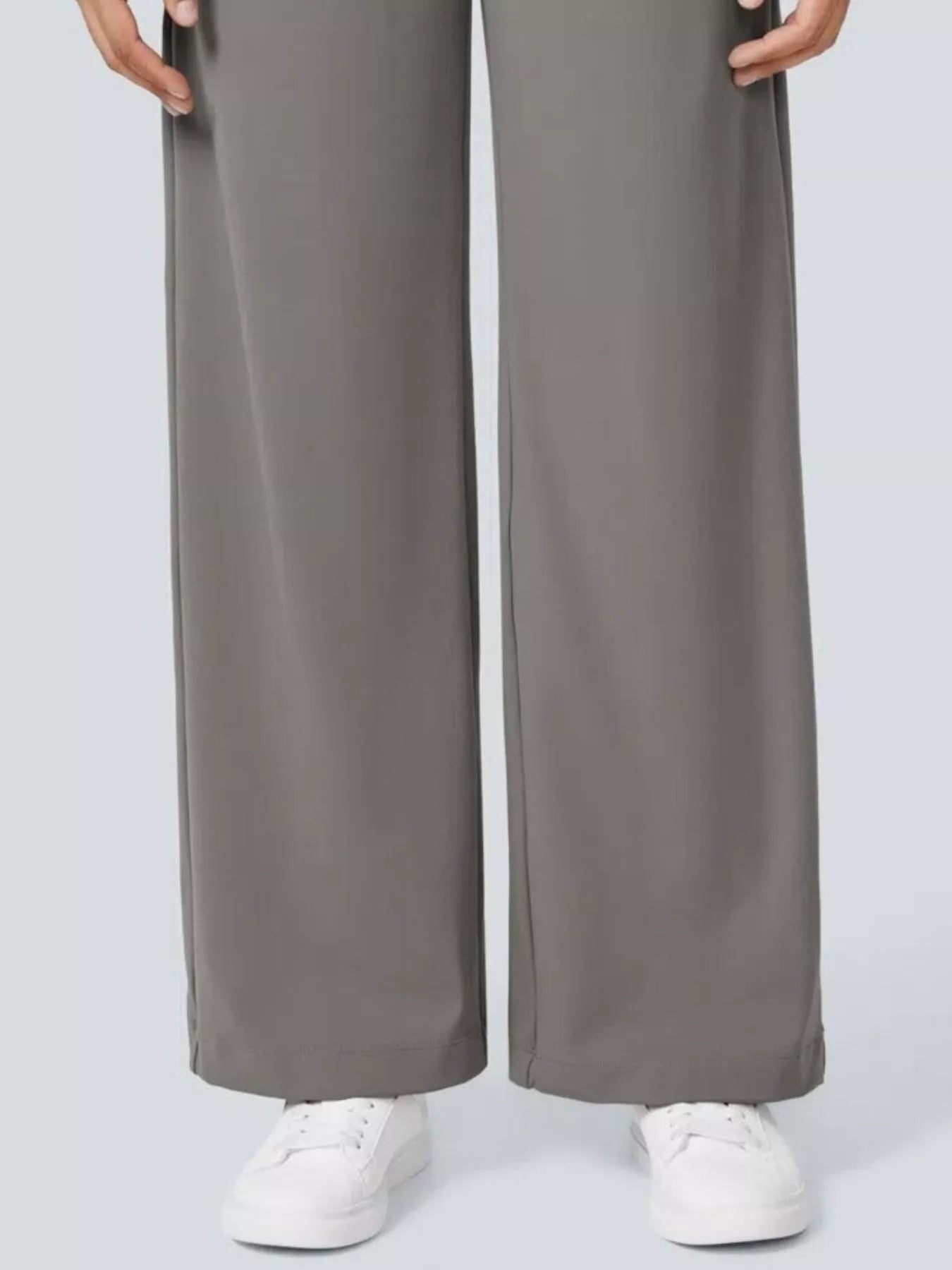 Gray wide-leg pants worn by a person on a light gray background