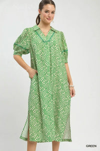 Woman wearing a green patterned dress on a white background