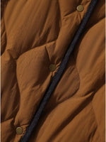 A view of the closed snaps on Diamond-Quilted Lightweight Cropped Reversible Down Jacket