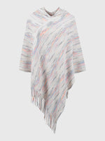 Striped poncho with fringes on a white background