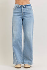 Light blue jeans on a plain background