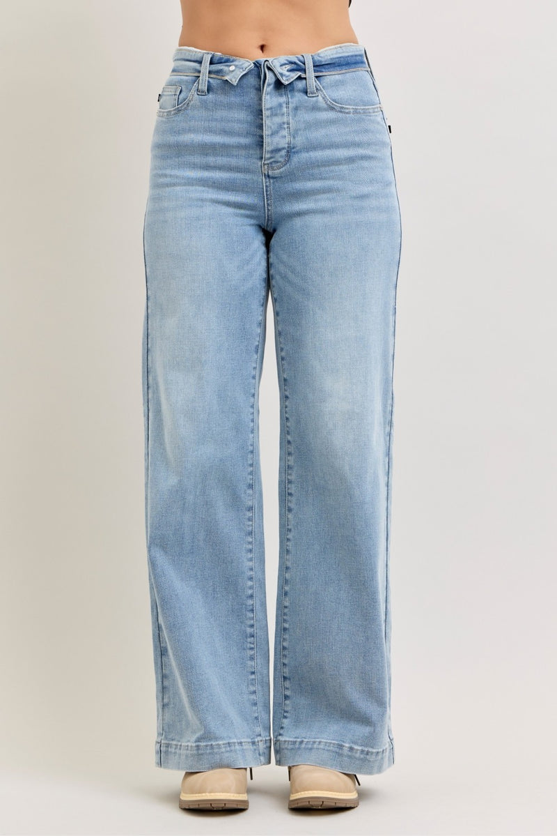 Light blue jeans on a plain background