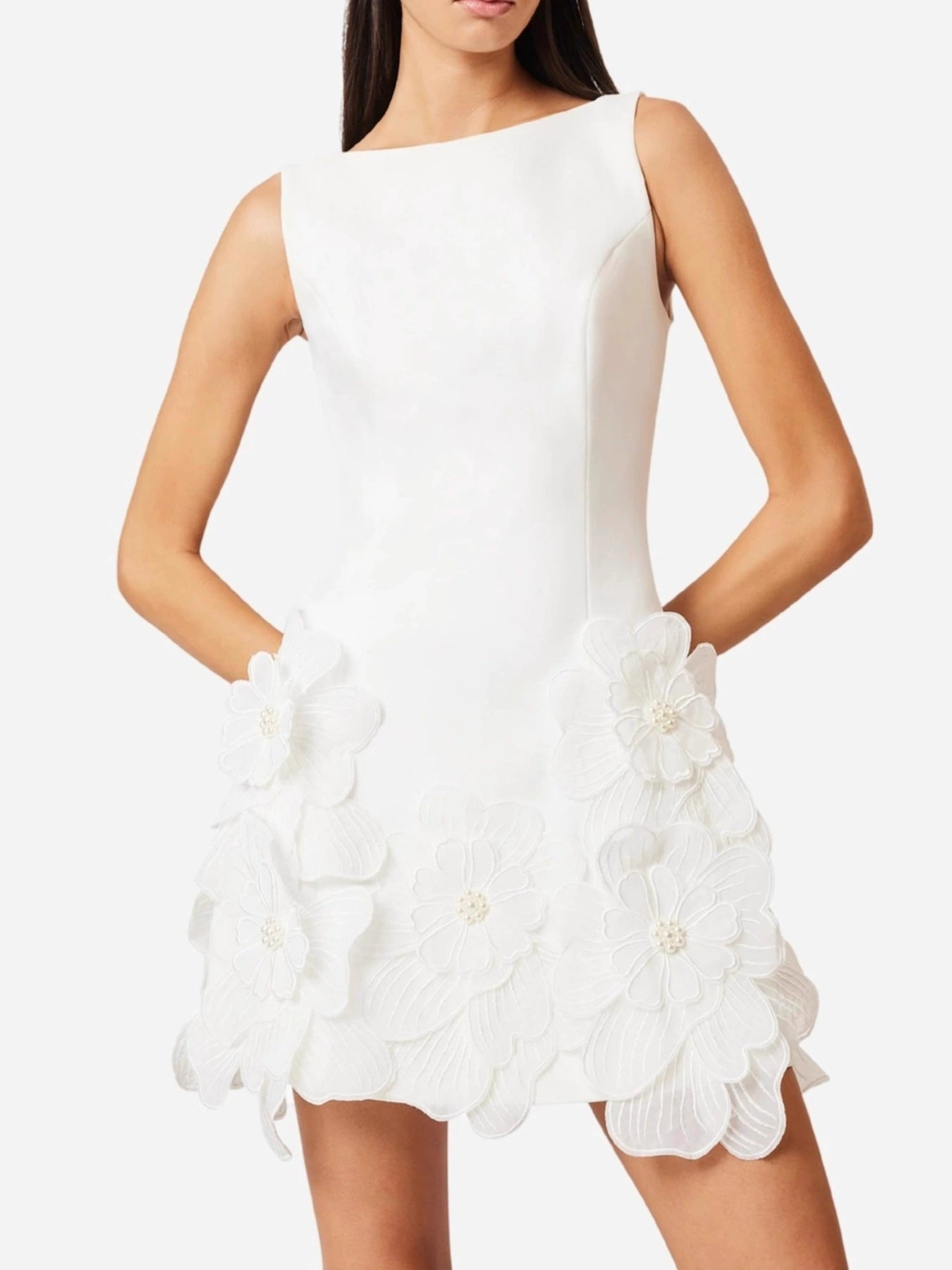 White dress with floral details on a white background