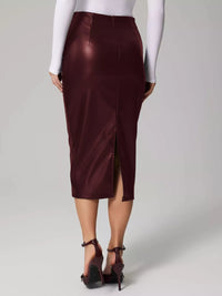 Person wearing a burgundy satin skirt on a plain background