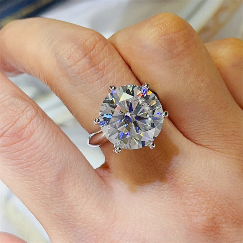 Diamond ring on a finger with a blurred background