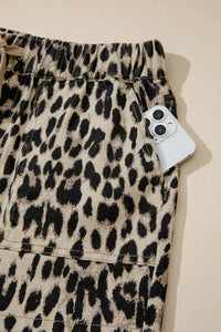 Leopard print shorts with a tag on a beige background