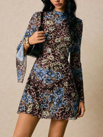 Woman wearing a floral and leopard print dress against a beige background