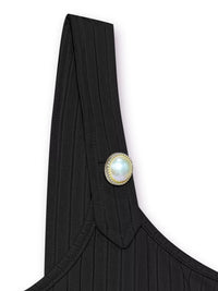 Black garment with a pearl button on a white background