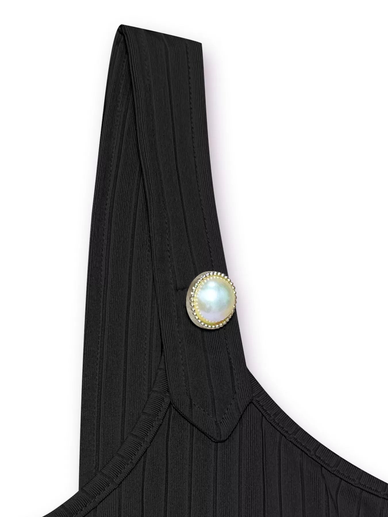 Black garment with a pearl button on a white background