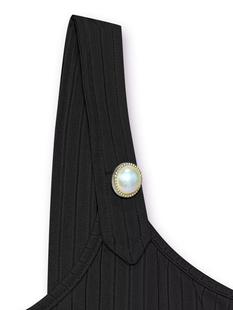 Black garment with a pearl button on a white background