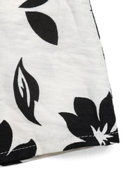 Close-up of a white fabric with black leaf pattern